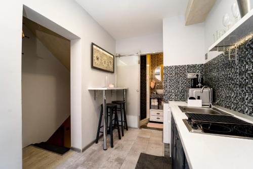 a kitchen with a sink and a counter top at French House in Belgrade