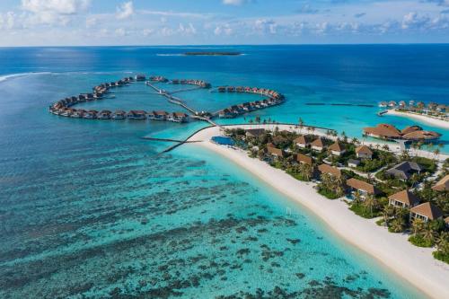 an aerial view of a resort in the ocean at Radisson Blu Resort Maldives with 50 percent off on Sea Plane round trip 03 nights & above in Fenfushi