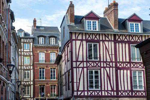 a group of old buildings in a city at Radisson Blu Hotel, Rouen Centre in Rouen