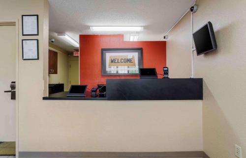 a waiting room with two laptops on a counter at Extended Stay America Select Suites - Chattanooga - Airport in Chattanooga