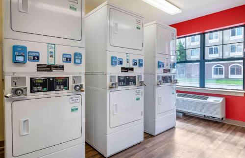 a group of white appliances in a room at Extended Stay America Suites - Merrillville - US Rte 30 in Merrillville
