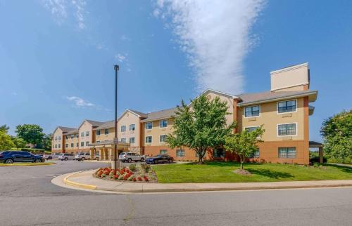 a large apartment building with a street in front of it at Extended Stay America Suites - Washington, DC - Sterling in Sterling