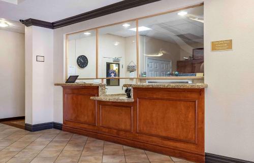 a lobby with a counter with a mirror at Extended Stay America Suites - Houston - Kingwood in Kingwood