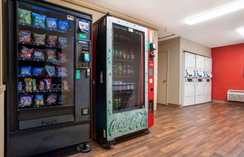 a soda vending machine in a store with drinks at Extended Stay America Select Suites - Baton Rouge - Citiplace in Baton Rouge