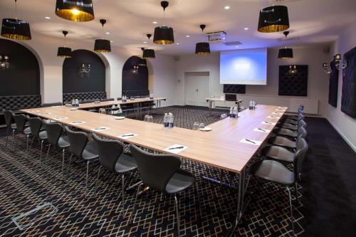 a large conference room with a large table and chairs at Best Western Plus Hotel Eyde in Herning