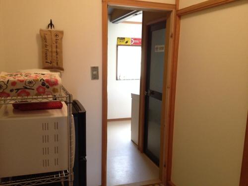 a room with a door leading into a room at Stay Nikko Guesthouse in Nikko