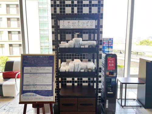 a display of towels in a store with a sign at New Otani Inn Yokohama Premium in Yokohama