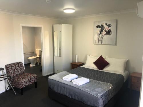 Ένα ή περισσότερα κρεβάτια σε δωμάτιο στο Matariki Motor Lodge