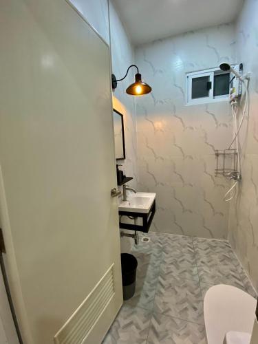 a bathroom with a toilet and a sink at Baan Patcharintorn Samui in Chaweng