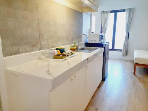 a kitchen with a sink and a counter top at Baan 192 in Bangkok