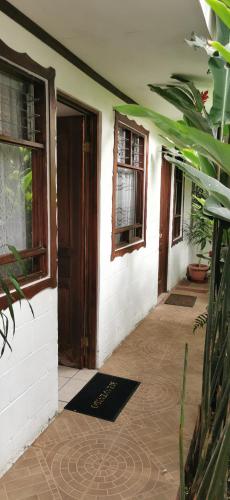 an entrance to a house with a door at Casa Kibi Kibi in San José