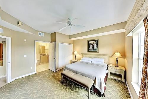 a large bedroom with a bed and a bathroom at Entire Rental 3-BR Minutes from Disney x8 Hot tub Apartment 2204 in Orlando