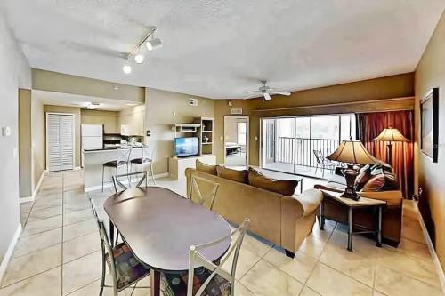 a living room with a couch and a table at Entire Rental 3-BR Minutes from Disney x8 Hot tub Apartment 2204 in Orlando