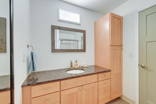 a bathroom with a sink and a mirror at Lovely Soldotna Home, Steps From Kenai River in Soldotna