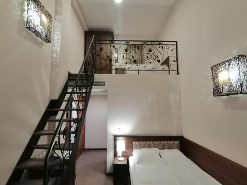 Postel nebo postele na pokoji v ubytování Hotel Aristokrat