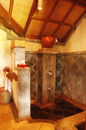 a bathroom with a counter with a sink in it at Puri Bagus Manggis in Candidasa