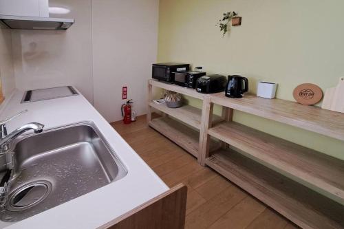 Dapur atau dapur kecil di ホリデーハウス慈野(ジノ)