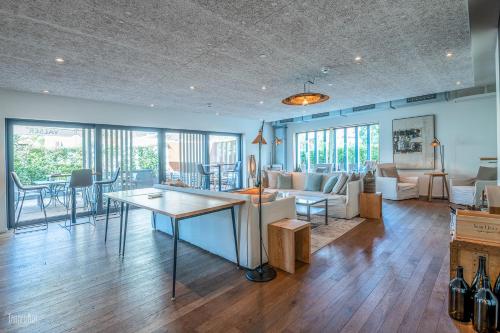 a living room with a couch and a table at Hirschen Erlinsbach Swiss Quality in Erlinsbach