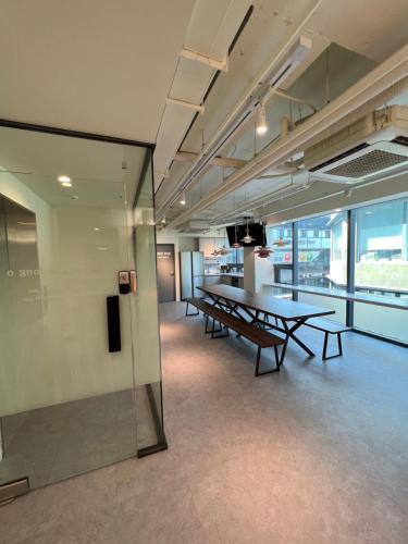 a conference room with a table and a glass wall at Seoul Cube Jongro in Seoul