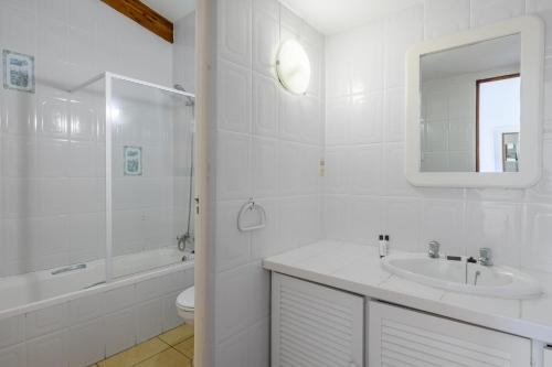 a bathroom with a sink and a toilet and a mirror at San Lameer Villa 1902 - 2 Bedroom Classic - 4 pax - San Lameer Rental Agency in Southbroom