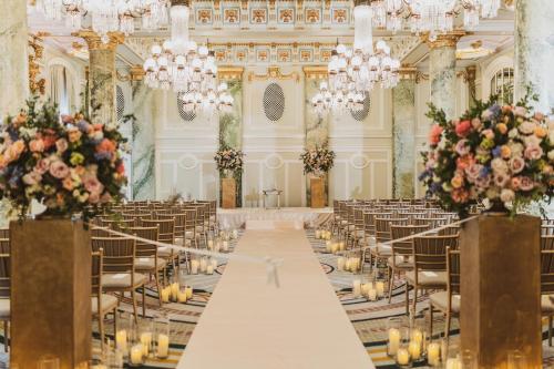 a long aisle in a banquet hall with chandeliers at Willard InterContinental Washington by IHG in Washington
