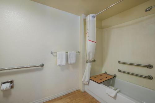 a bathroom with a shower and a sink at Red Roof Inn Fairfield in Fairfield