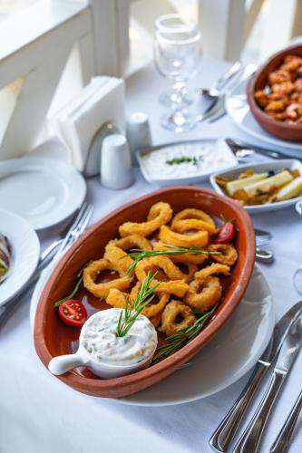 a bowl of food sitting on a table at Oz Hotels Incekum Beach in Alanya