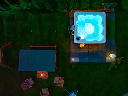 an overhead view of a pool in a yard at night at Osada Zbójnicka Turnia in Kościelisko