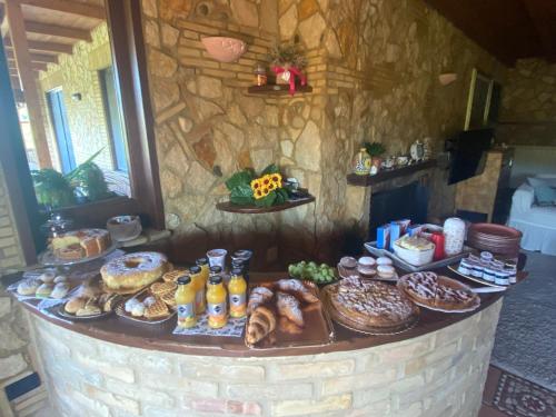 a brick counter with different types of donuts and pastries at Villa Paola in Villa San Leonardo