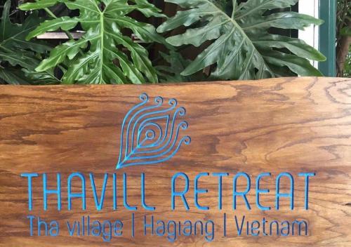 a sign that reads thankful retreat the village of haagenging vioren at Thavill Retreat HaGiang in Ha Giang