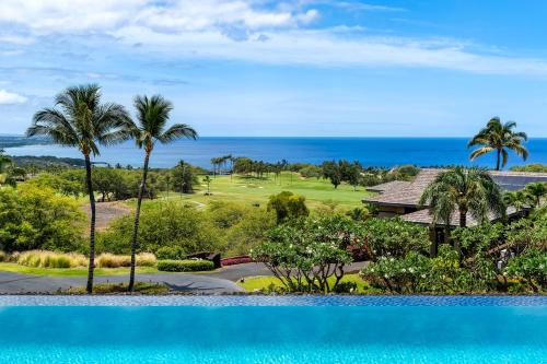 a view of a golf course and the ocean at Hapuna Modern House at Mauna Kea in Hapuna Beach