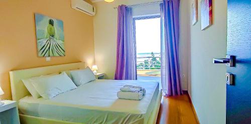 Ένα ή περισσότερα κρεβάτια σε δωμάτιο στο Avatonblue Villa Nafplio