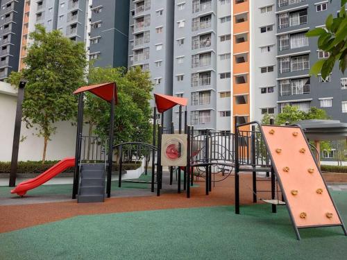 a playground with a slide and a slideintend at FA Homestay Alanis, Near KLIA in Sepang