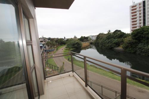 a balcony with a view of a river at Spindrift 7 in Margate