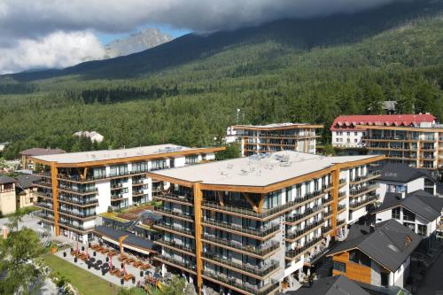 an aerial view of a city with buildings and a mountain at TATRYSTAY Private Apartments Hrebienok in Starý Smokovec