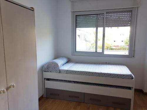 Кровать или кровати в номере Fantástico apartamento con piscina en Tossa de Mar