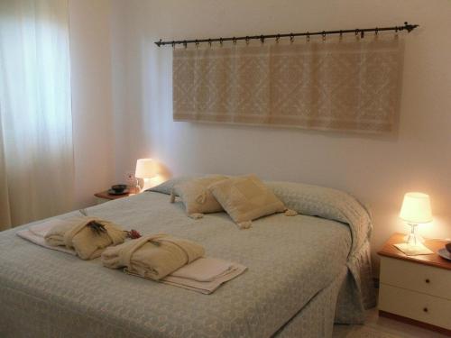 En eller flere senge i et værelse på B&B Fragus e Saboris de Sardigna