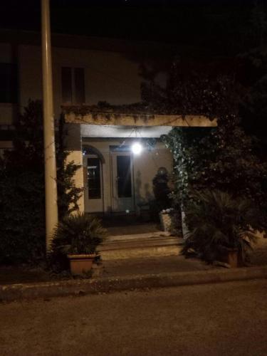 an entrance to a house at night with a light at B&B Fragus e Saboris de Sardigna in Sadali