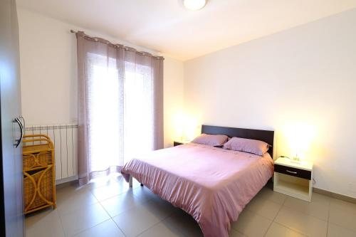 En eller flere senge i et værelse på Myconos C2 - Pineto Vacanza