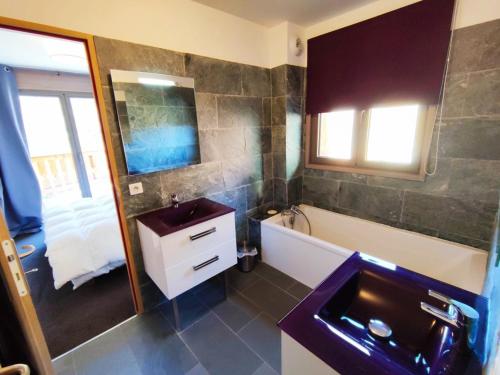 a bathroom with a sink and a tub and a mirror at Superbe appartement à Isola 2000, 8 couchages, parking privé, à 5 min des pistes et commerces - FR-1-292-112 in Isola 2000