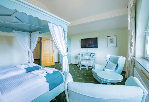 Postel nebo postele na pokoji v ubytování Ferien Hotel Fläming