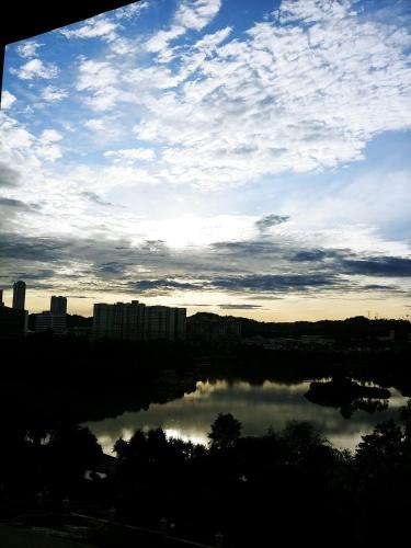 a view of a body of water with a city at Homestay King Putrajaya sebelah Alamanda in Putrajaya