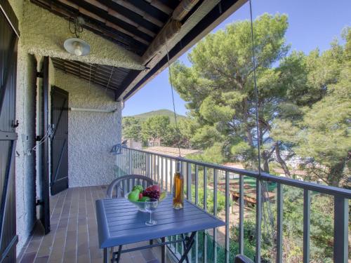 a blue table on the balcony of a house at Apartment Les Aigues Marines-12 by Interhome in La Madrague
