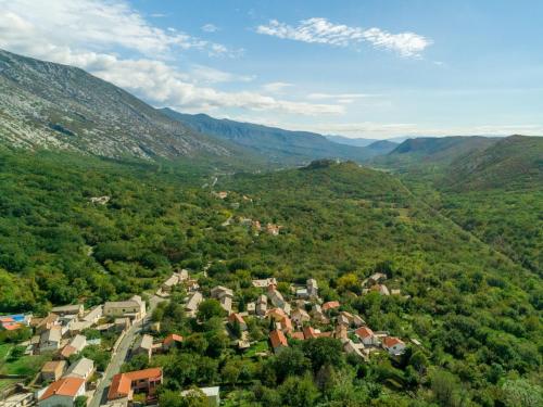 an aerial view of a small village in the mountains at Holiday Home Lukata by Interhome in Drivenik