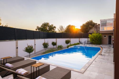 a swimming pool on top of a house at Holiday Home Korda in Čapljina