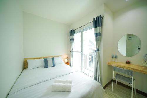 Nut Home Hostel tesisinde bir odada yatak veya yataklar