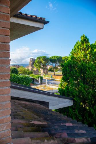 a view of the ocean from a brick building at La Villa dei Tartufi - B&B in Corfinio