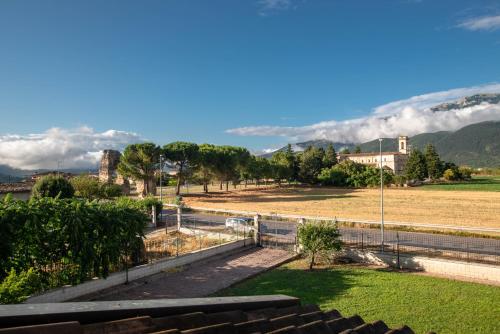 a view of a field with mountains in the background at La Villa dei Tartufi - B&B in Corfinio
