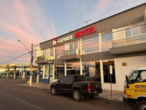 a truck parked in front of a shopping center at Grande Hotel in Gurupi