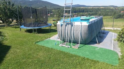 an image of a pool with a trampoline at Ranczo pod Klimoską in Rzyki